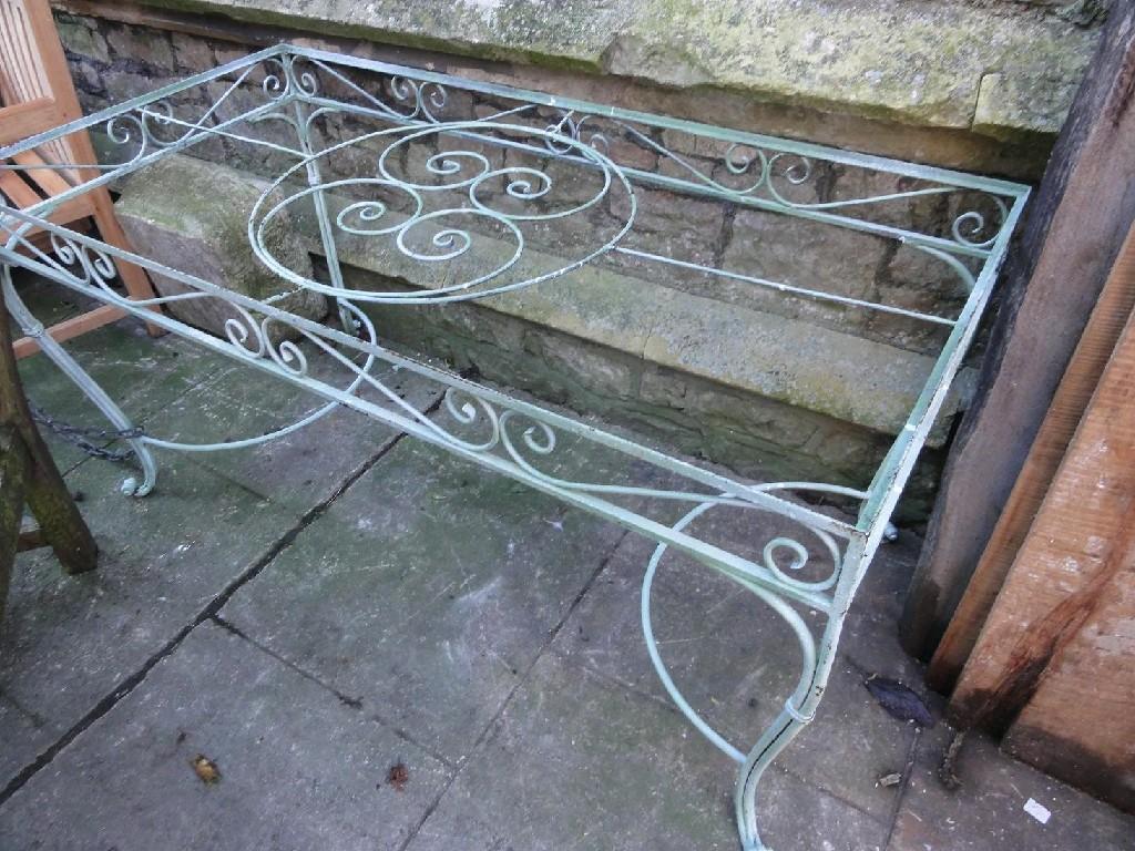 Appraisal: A wrought iron conservatory garden table of rectangular form with