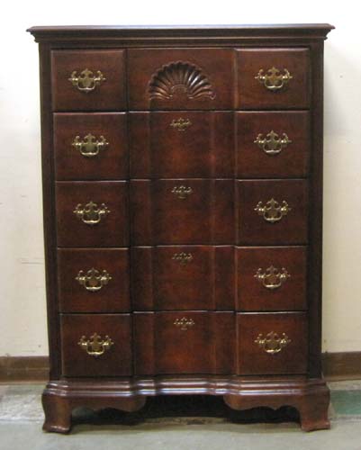 Appraisal: CHIPPENDALE STYLE BLOCK-FRONT CHEST OF DRAWERS recent featuring a stack