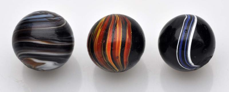 Appraisal: Lot of Handmade Marbles Lot includes a brown and white