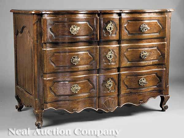 Appraisal: An Antique French Provincial Fruitwood Commode the serpentine molded top