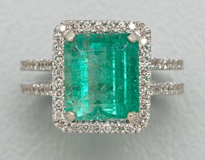 Appraisal: Emerald and diamond ring central emerald-cut emerald estimated weighted cts