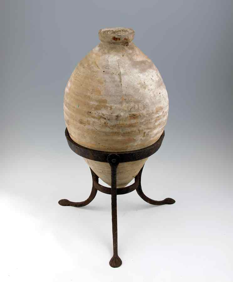 Appraisal: POTTERY JUG ON STAND Earthenware jug of unknown origin and