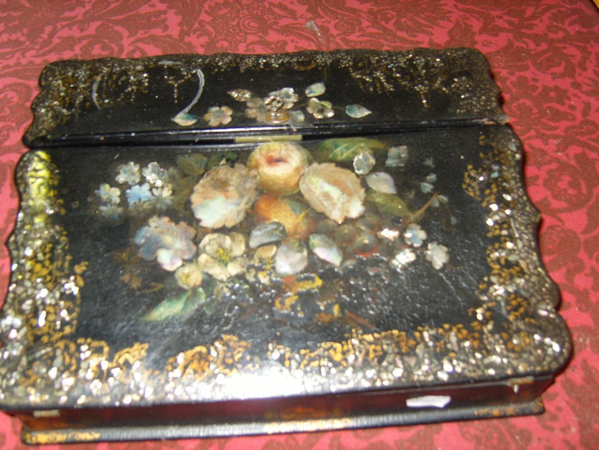 Appraisal: A th century black papier-mache writing slope with painted floral