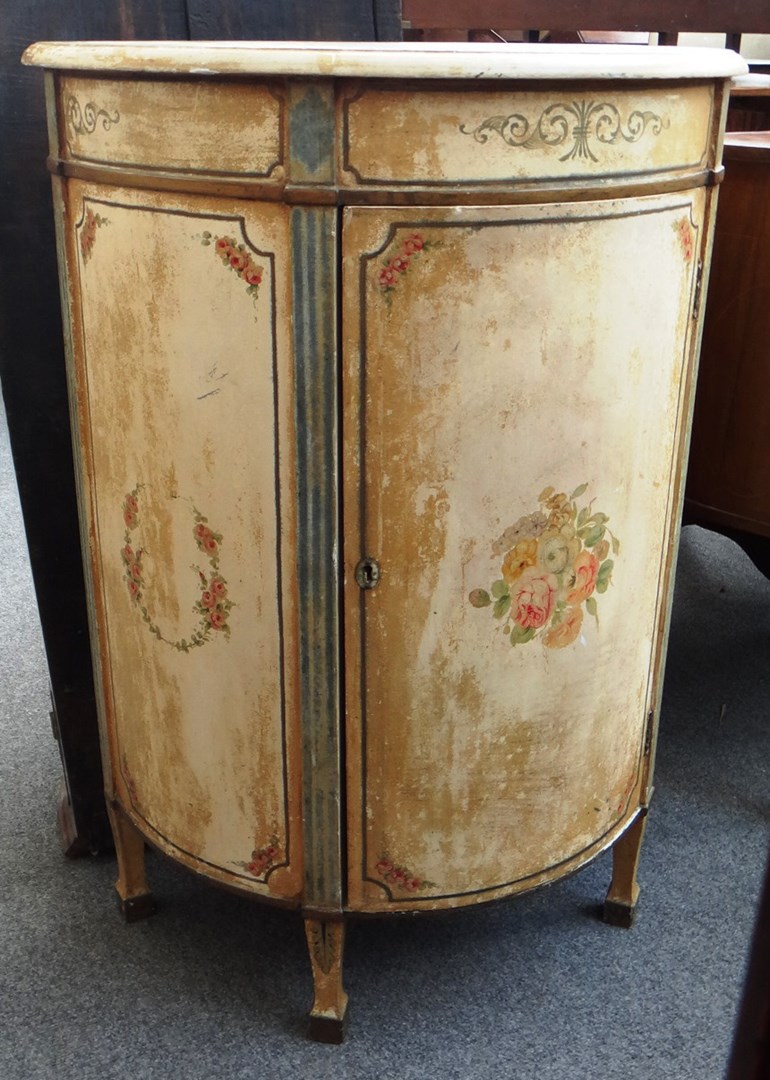 Appraisal: An early th century floral painted demi-lune side cabinet with