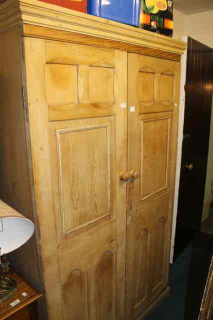 Appraisal: A TH CENTURY STRIPPED PINE CUPBOARD of full height enclosed