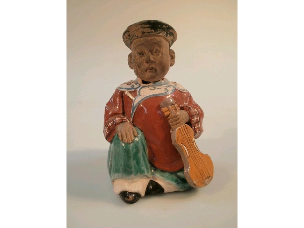 Appraisal: An early thC Chinese semi-glazed pottery figure of a mandarin