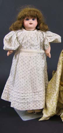 Appraisal: FRENCH AUTOMATON DOLL The bisque head with blue eyes open