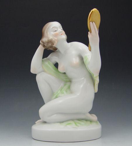 Appraisal: HUNGARIAN HEREND PORCELAIN NUDE FIGURE Kneeling woman with a mirror