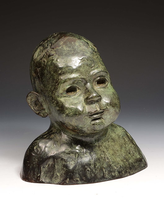 Appraisal: Maurice Juggins - A bronze head of a young child