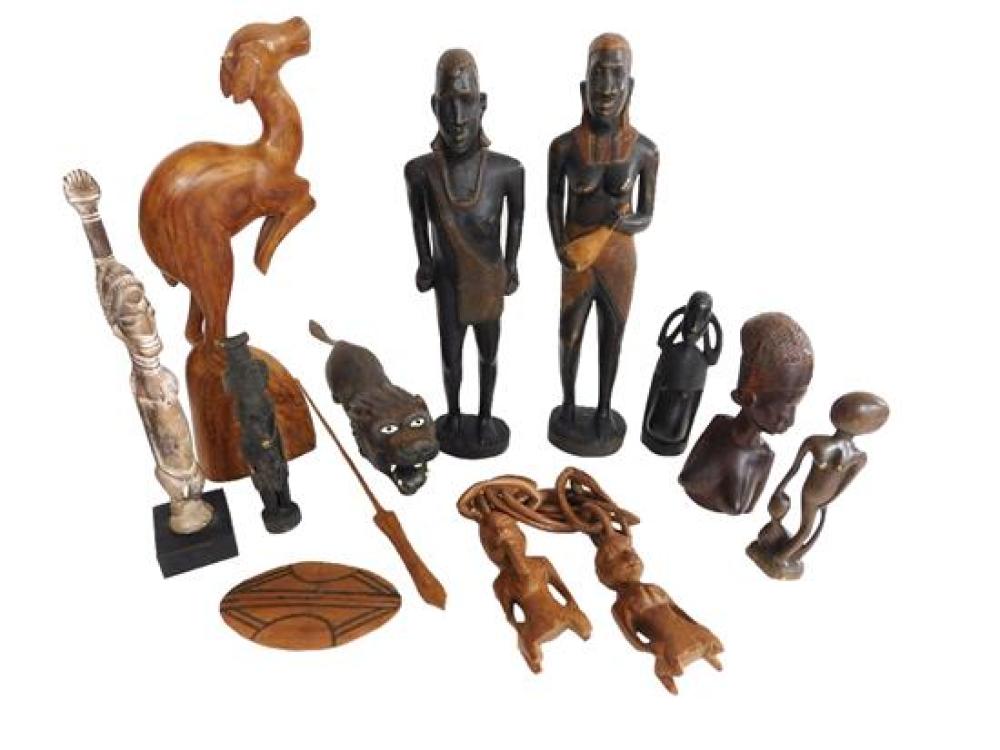 Appraisal: TRIBAL Assortment of th C African carved wood sculptures a