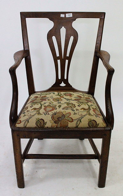 Appraisal: A CHIPPENDALE STYLE ELM COUNTRY CHAIR with vase shaped splat