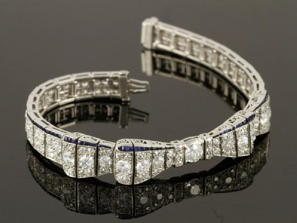 Appraisal: - Ladies' Platinum Diamond and Sapphire Bow Bracelet Ladies' platinum