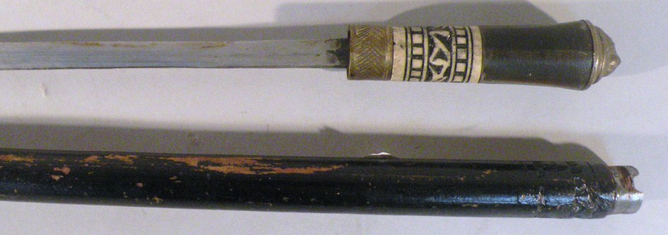 Appraisal: A thC sword stick with brass and metal part carved