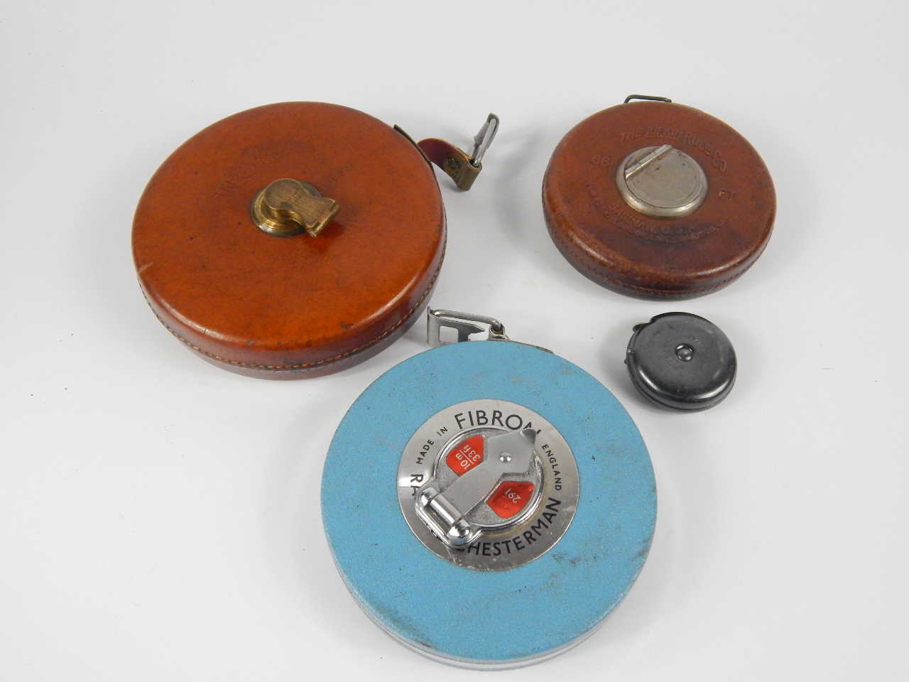 Appraisal: A Lufkin Rule Co leather cased tape measure ft Saginaw