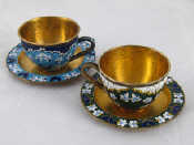 Appraisal: A pair of Soviet Russian cloisonne enamelled silver teacups and