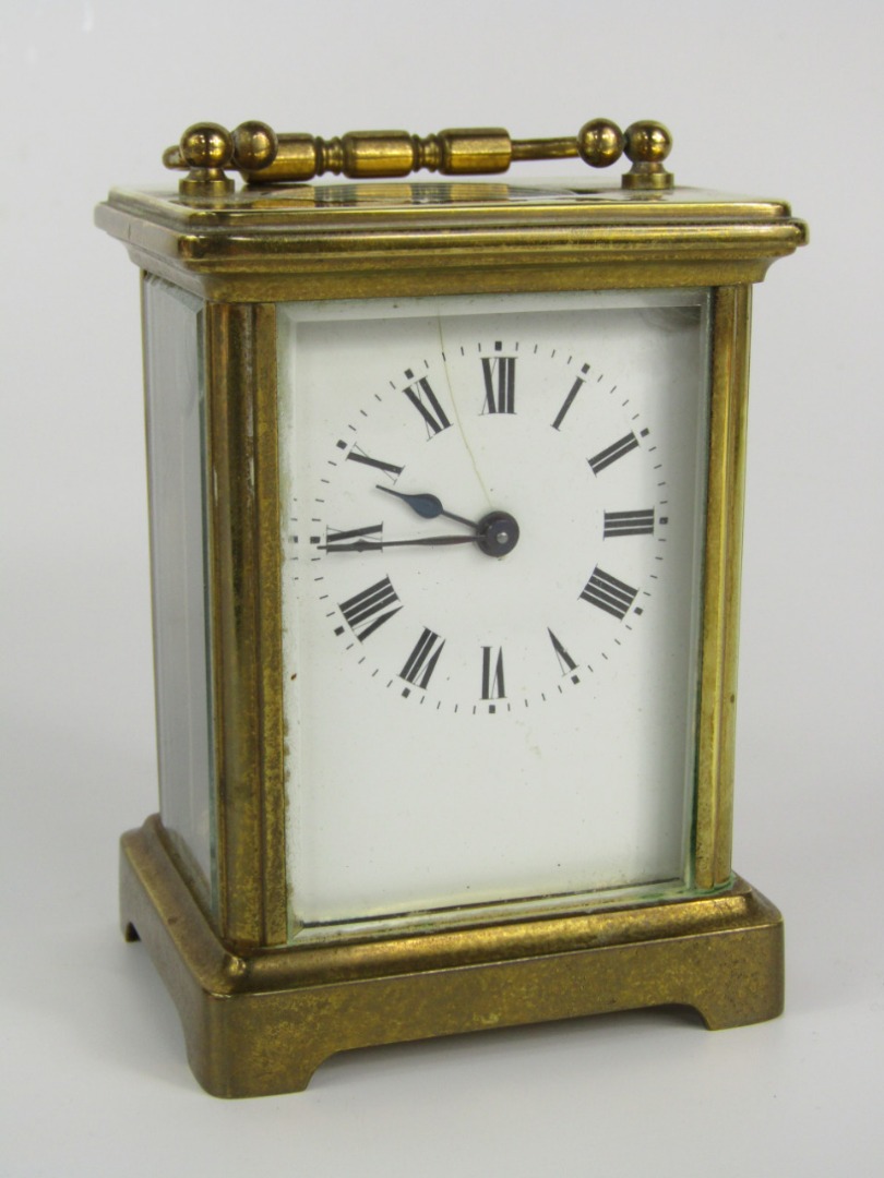 Appraisal: A brass cased carriage clock early thC white enamel dial