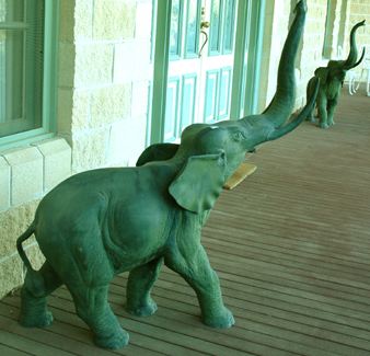 Appraisal: A PAIR OF PATINATED BRONZE ELEPHANTS Each animal standing with