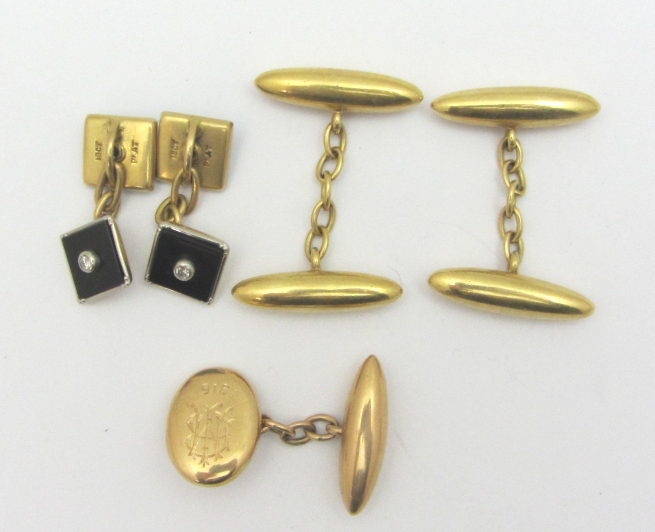 Appraisal: A pair of gold cufflinks with torpedo shaped backs and