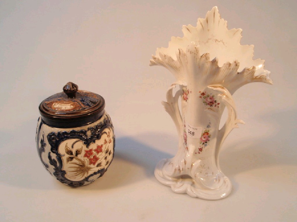 Appraisal: A French porcelain naturalistic vase and a stoneware tobacco jar