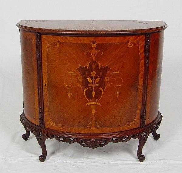 Appraisal: AMERICAN FRENCH STYLE DEMI-LUNE COMMODE Single door commode single shelf