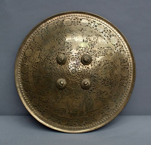 Appraisal: An Indian inch brass pierced shield with the Rajah and