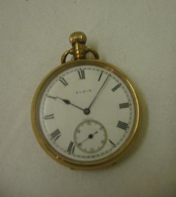 Appraisal: A CT GOLD POCKET WATCH by Elgin with white enamel