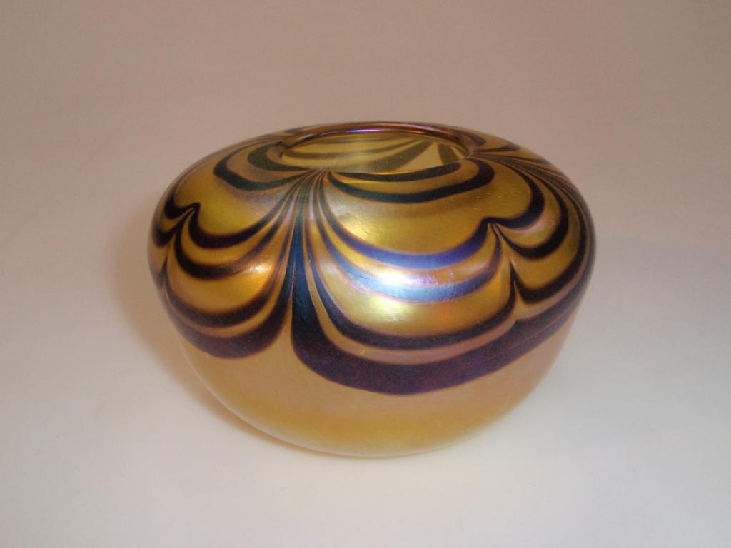 Appraisal: A Ditchfield Glasform bowl cased yellow lustre with iridescent scalloped