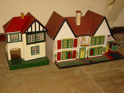 Appraisal: A painted wood doll's house with twin gabled roof opening