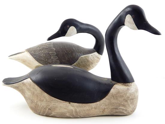 Appraisal: DECOYS Two Canadian geese decoys one floating one on cast-iron