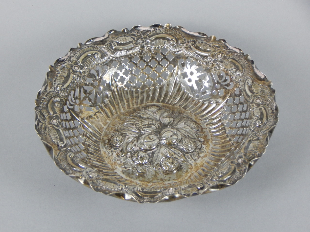 Appraisal: A Victorian silver bonbon dish with pierced and curved sides