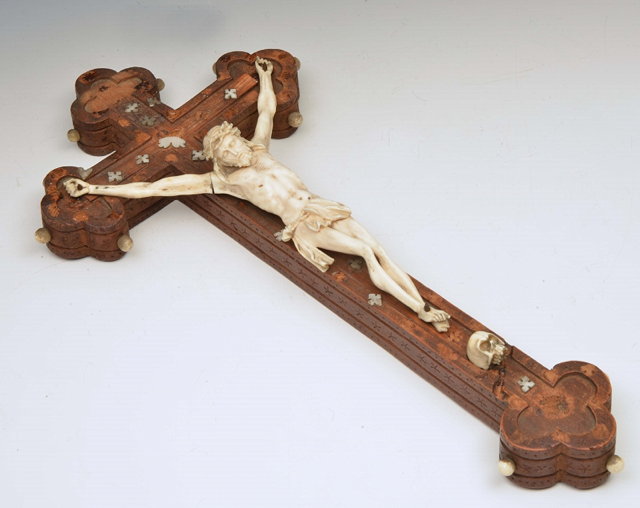 Appraisal: AN IVORY CRUCIFIX with figure on a carved wooden cross