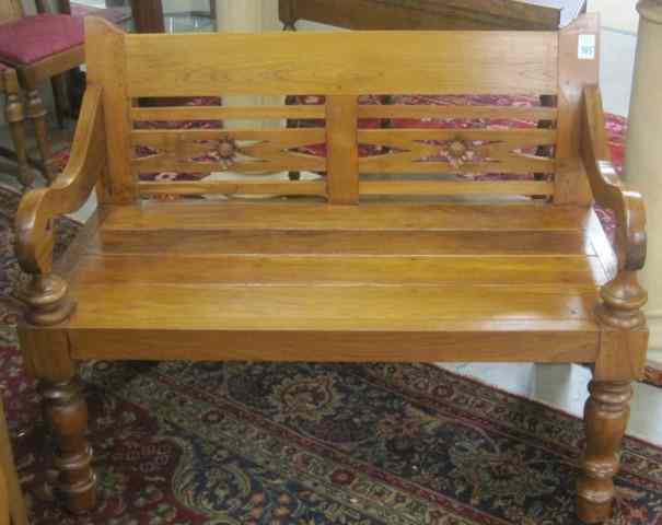 Appraisal: TEAKWOOD BENCH antique reproduction with plank bench seat open scroll