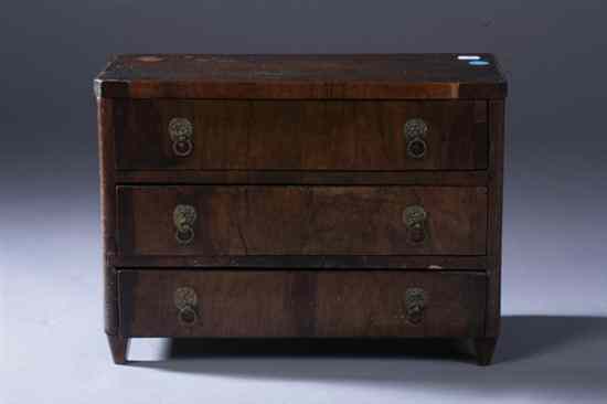 Appraisal: CONTINENTAL NEO-CLASSICAL STYLE MINIATURE THREE-DRAWER COMMODE th century Burled wood