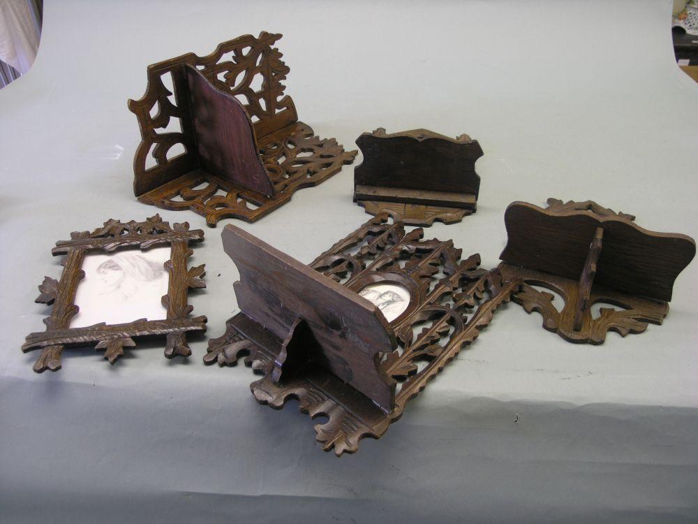 Appraisal: Four late th century Swiss carved wood wall brackets elaborately