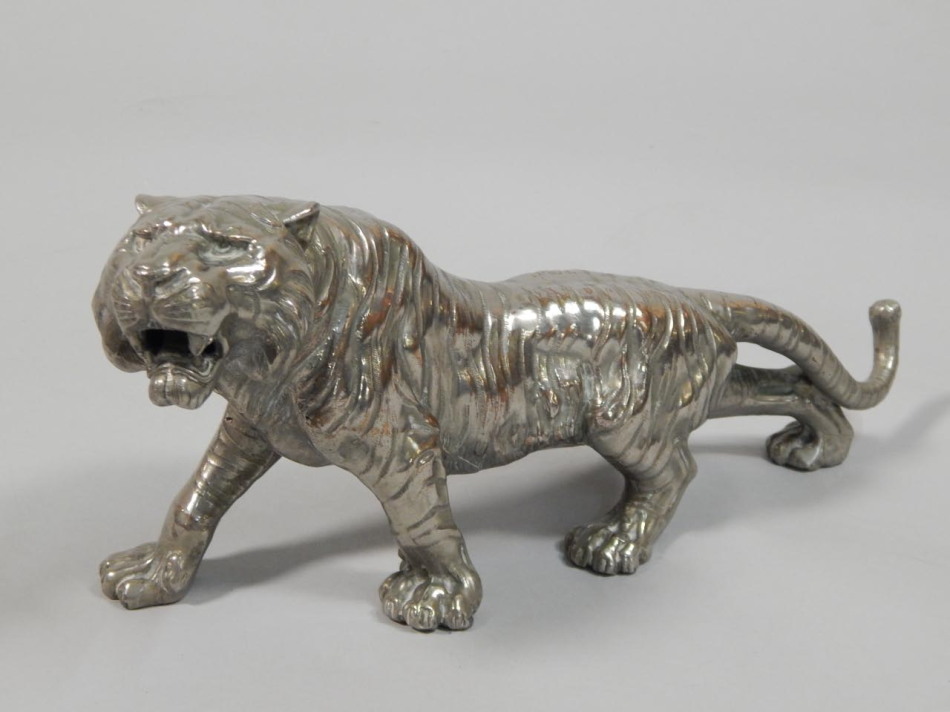 Appraisal: A Japanese type silvered copper figure of a tiger in