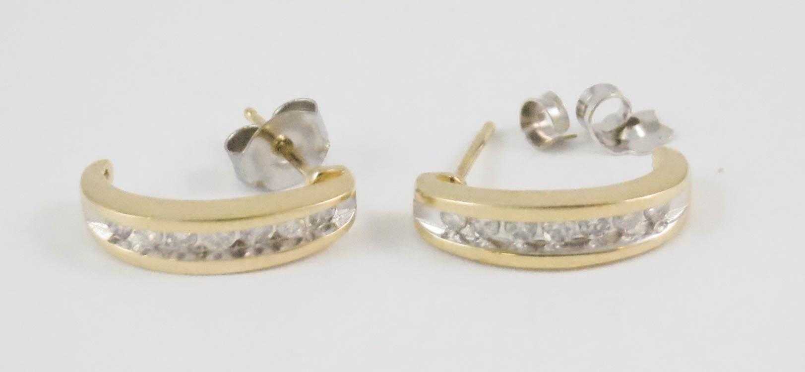 Appraisal: PAIR OF DIAMOND AND FOURTEEN KARAT GOLD EARRINGS each J-hoop