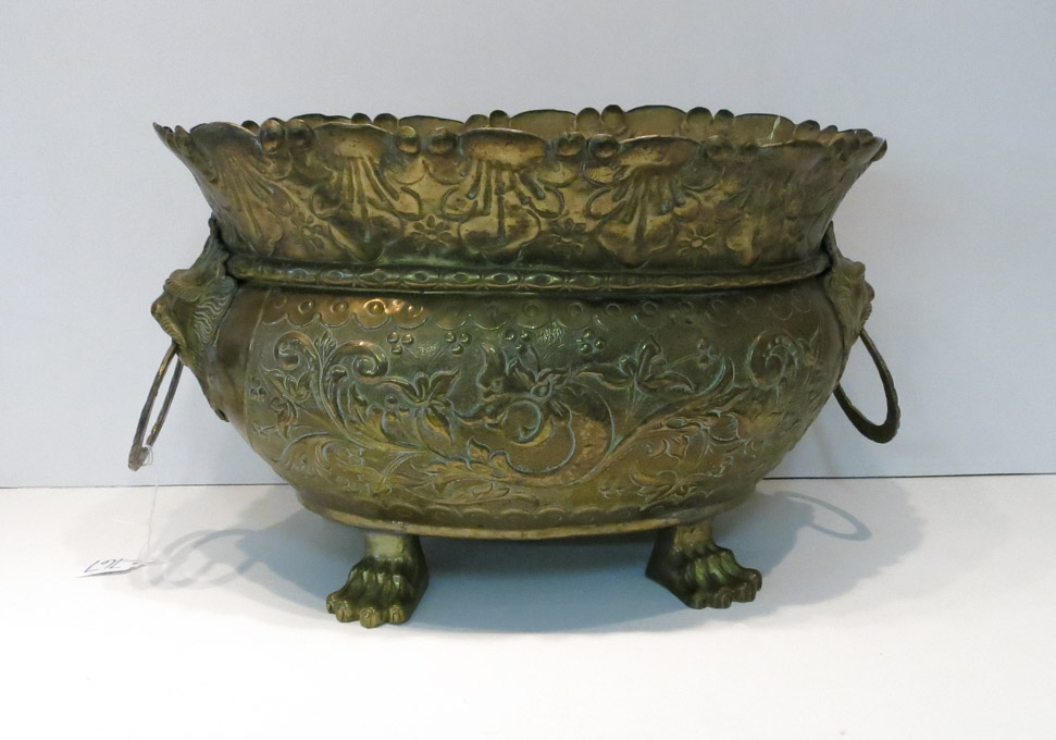 Appraisal: ENGLISH BRASS REPOUSSE JARDINIERE oval form raised on four lion