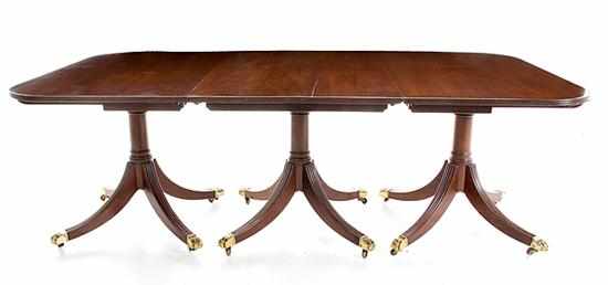 Appraisal: Georgian style mahogany three pedestal dining table late th century