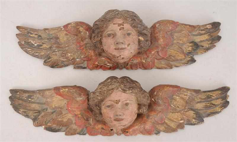 Appraisal: PAIR OF CONTINENTAL BAROQUE STYLE CARVED PAINTED AND PARCEL-GILT CHERUB-HEAD