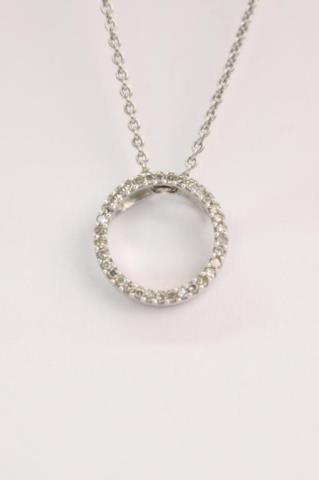 Appraisal: A K white gold circle pendant with thirty-three round diamonds