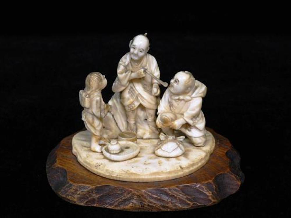 Appraisal: ASIAN Japanese okimono th th C caved ivory depicting three