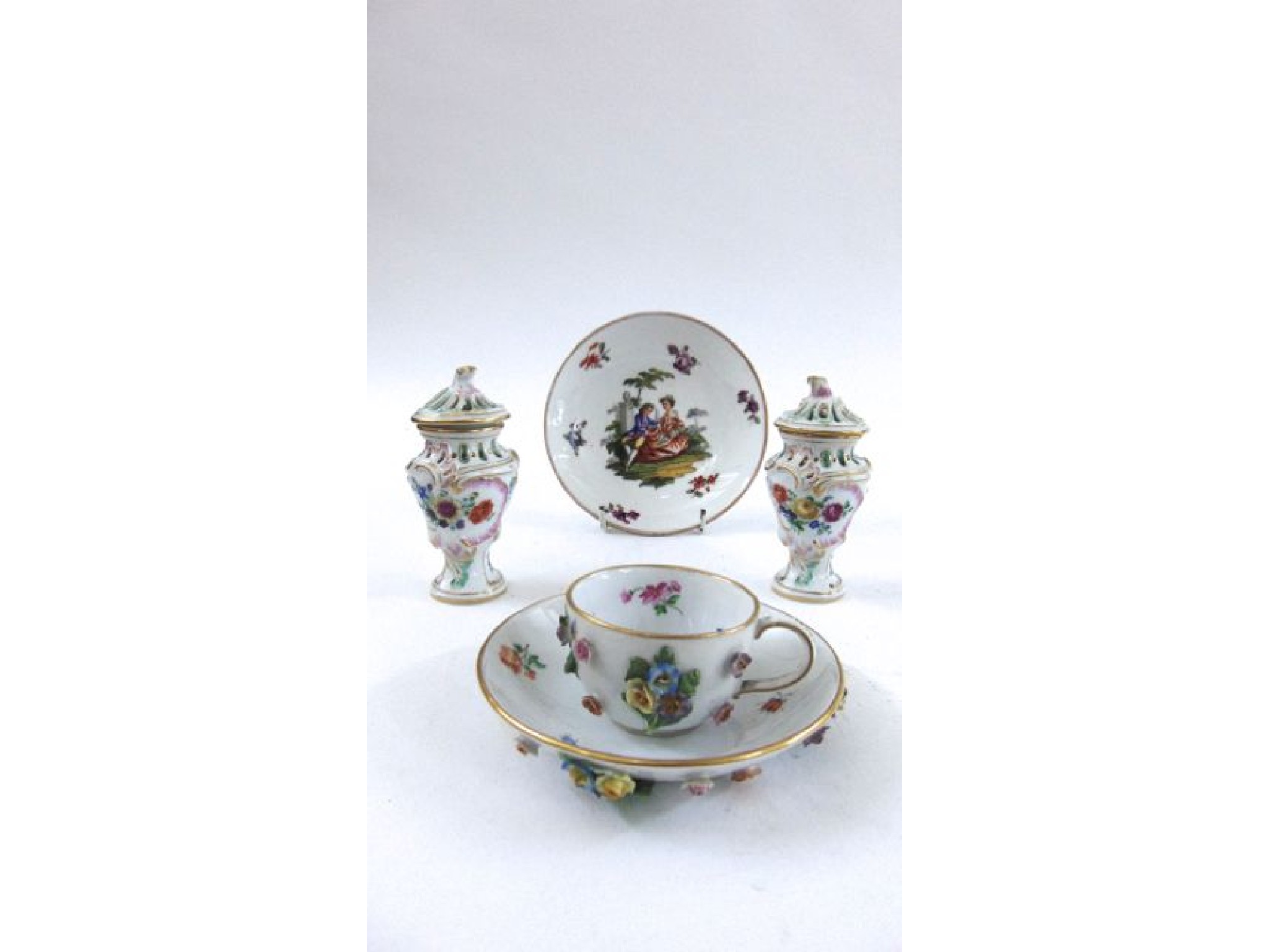 Appraisal: A Meissen floral encrusted cabinet cup and saucer additional saucer