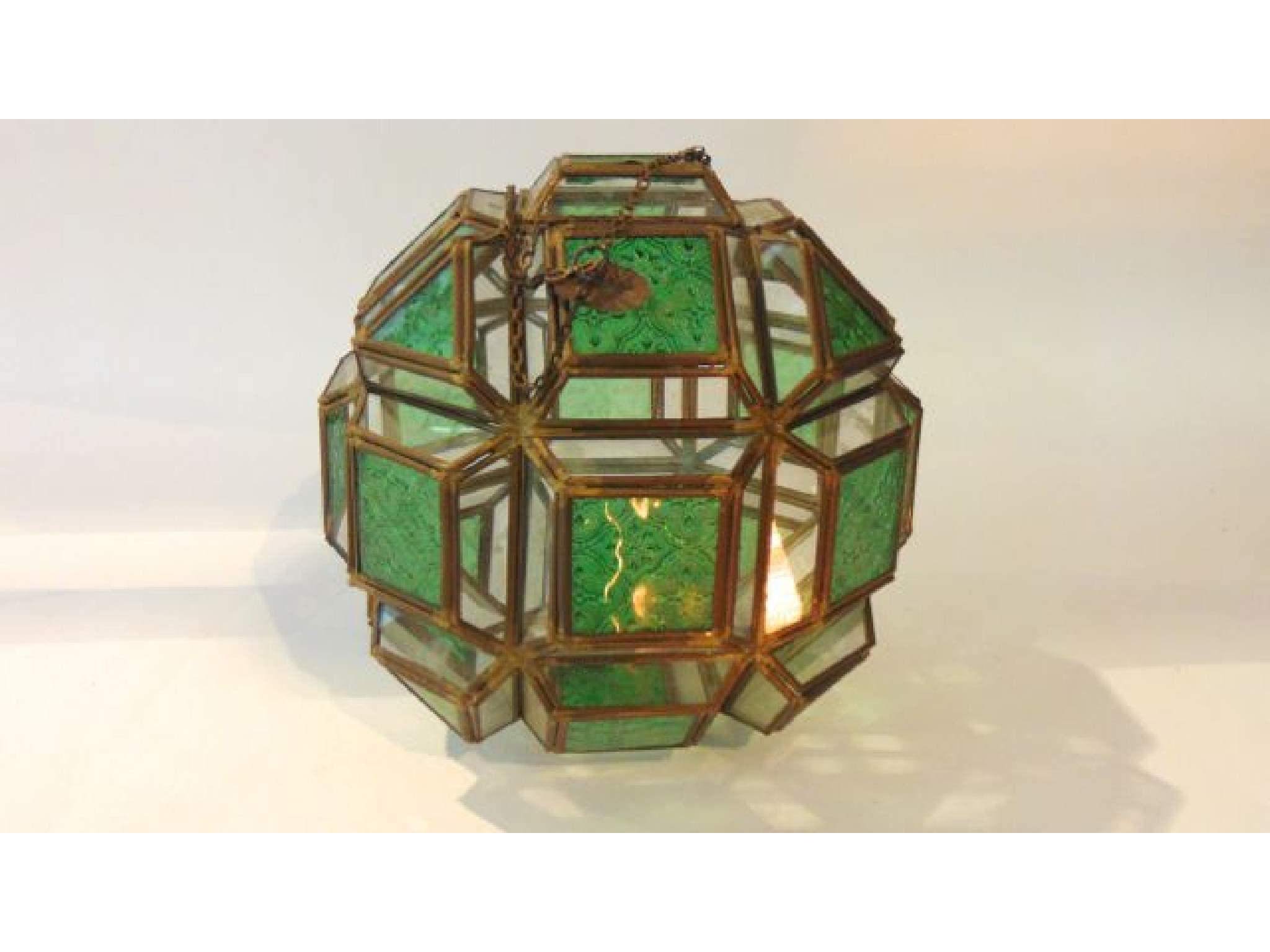 Appraisal: A faceted cylindrical glass ceiling lantern accommodating moulded green glass