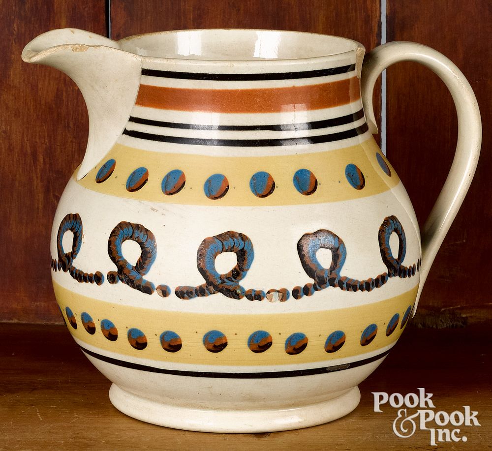 Appraisal: Mocha pitcher Mocha pitcher with cat's-eye and earthworm decoration h