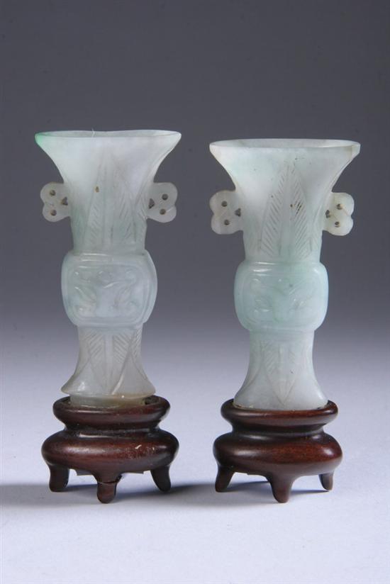 Appraisal: PAIR CHINESE GREEN JADE GU-FORM MINIATURE VASES Incised decoration -