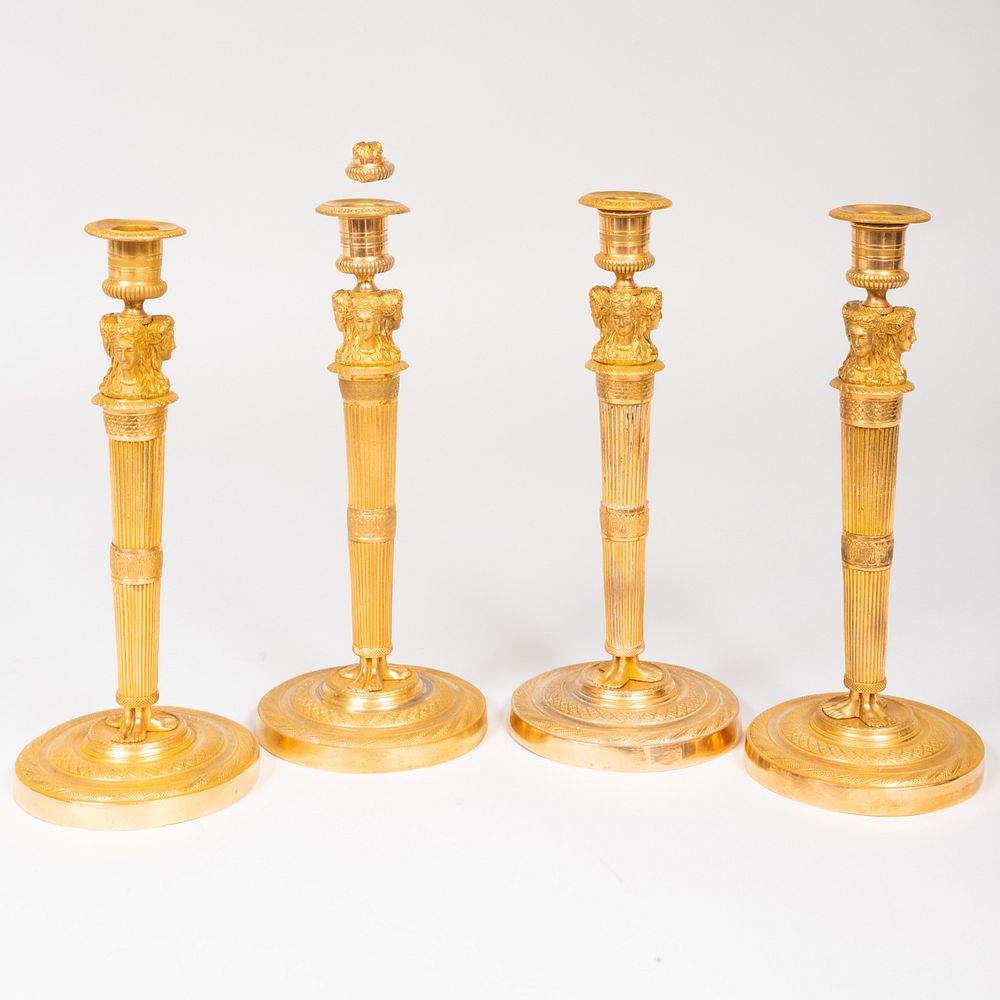 Appraisal: Four Directoire Ormolu Candlesticks x in diam Condition Minor wear