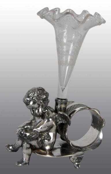 Appraisal: Winged Cherub Holding Vase Figural Napkin Ring Description Pairpoint Glass