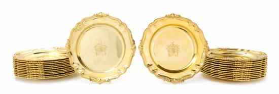 Appraisal: A Set of Twenty-Four Gilt Plates each with gadrooned scalloped