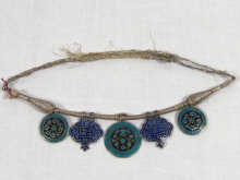 Appraisal: A necklace of cloisonne enamelled silver plaques on a silver