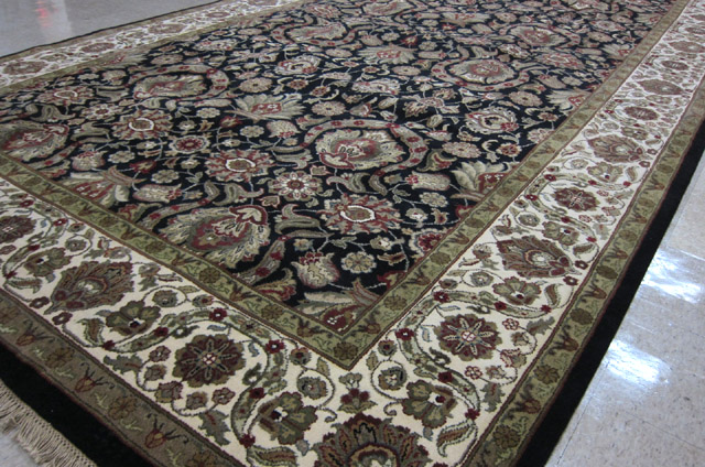 Appraisal: HAND KNOTTED ORIENTAL CARPET Indo-Persian overall floral design on black